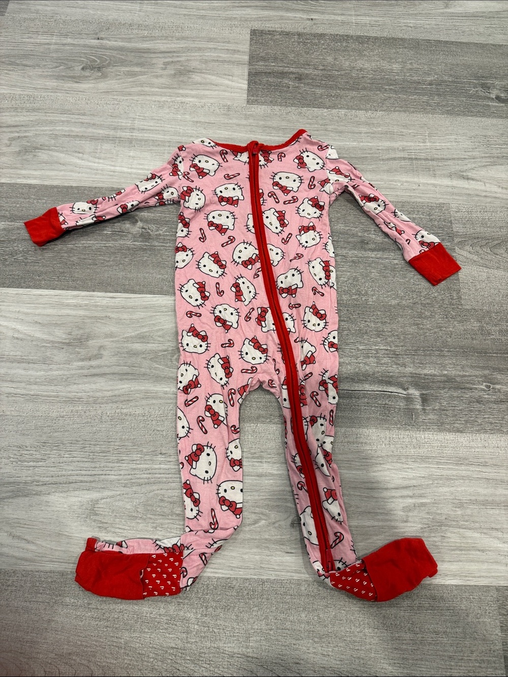 Posh Peanut Pink Hello Kitty Footed Candy Cane One-Piece Pajamas with Red Trim